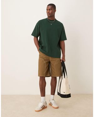 ASOS – lange shorts - Grün