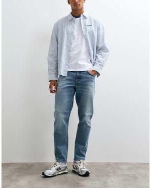 ASOS Toelopende Jeans Mid-Wash Met Tint - Blauw