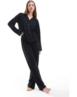 Loungeable Pyjama en jersey ultra doux avec haut à revers et pantalon large à liserés - Noir