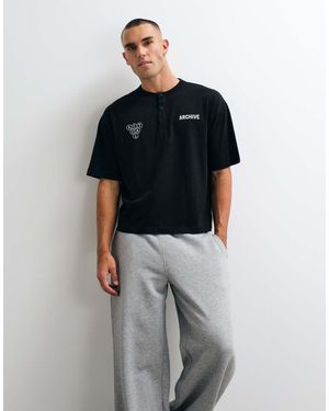 ASOS Boxy Oversized Henley T-shirt With Text Graphic - Black
