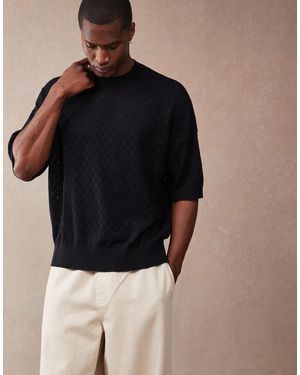 ASOS – kastiges oversize-t-shirt aus strick - Schwarz