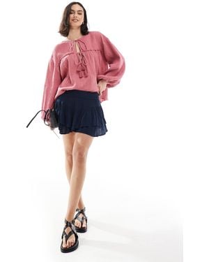 Hollister – femme – asymmetrischer, gestufter mini-skort - Pink