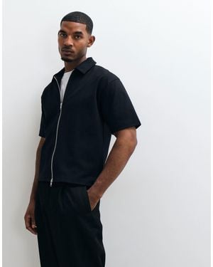 ASOS Polo en interlock coupe carrée relaxed à zip - Bleu