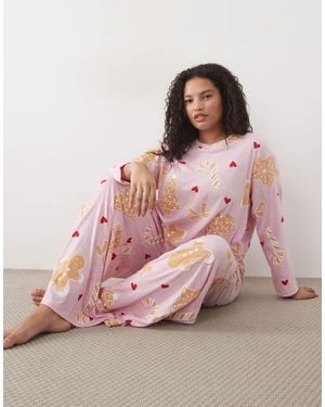 ASOS Asos design curve pyjama-set mit langärmligem oberteil, weiter hose und christmas-cookie-print - Pink