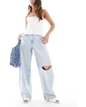 ASOS Jean large à taille haute déchiré - délavage clair - Bleu