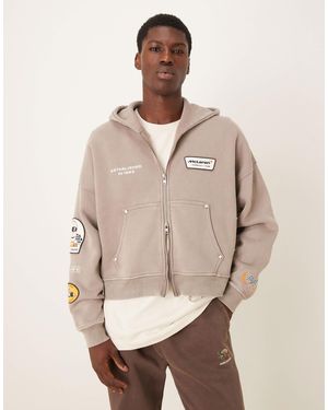 Abercrombie & Fitch Sweat à capuche zippé avec motif f1 - beige - Neutre