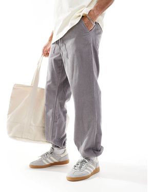ASOS – schmal zulaufende cord-jogginghose - Grau