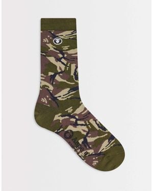 Aape By A Bathing Ape Aape by a bathing ape - chaussettes à motif camouflage - Vert
