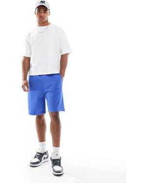 Superdry Essential - short en jersey à logo - chambray - Bleu