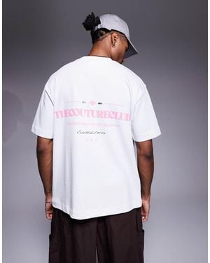 The Couture Club T-Shirt Oversize Bianca Con Stampa Rosa Del Logo Sul Petto E Sul Retro - Bianco