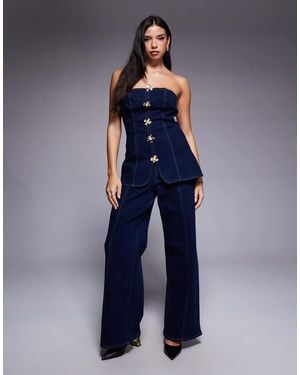 River Island Combinaison en jean à boutons en fleur - foncé - Bleu