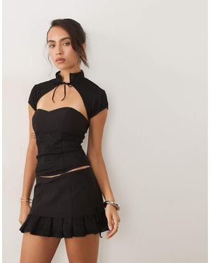 I.AM.GIA Aris Sculpting Stretch Lage Taille Rok Met Kanten Rand En Ruches - Zwart