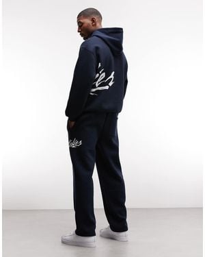ASOS Straight Leg jogger With Text Print - Blue