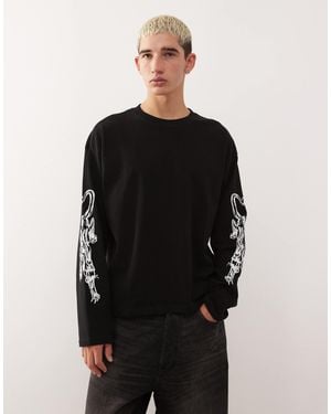 Weekday – kastiges, langärmliges oversize-t-shirt - Schwarz
