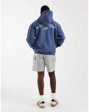 ASOS Sweat à capuche oversize avec imprimé pigmenté - délavé - Bleu
