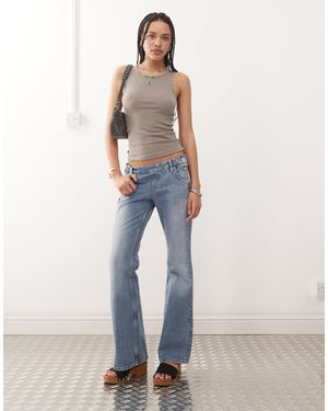Weekday Low Waist Flare Jeans With Side Button Western Detail - Blue