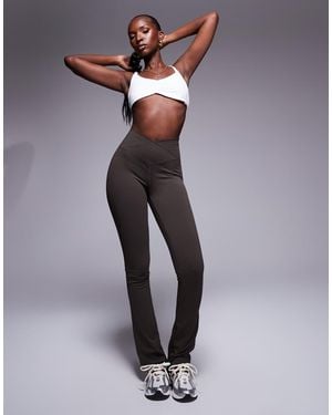 The Couture Club Sculpting Stretch Emblem Flare Leggings - Brown