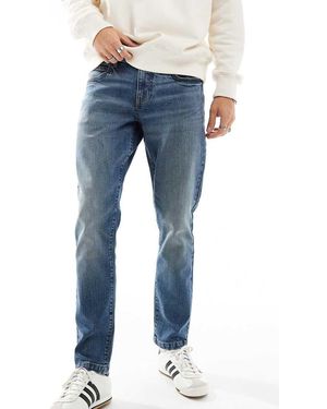 ASOS Vaqueros Azules De Corte Slim Con Lavado Medio Tintado De