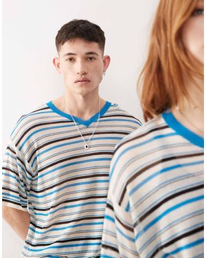 Collusion Unisex - polo en maille à rayures avec détail col - Bleu