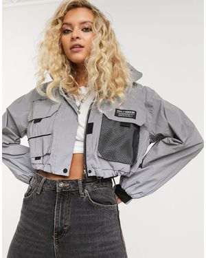 Bershka Chaqueta cortavientos con diseño reflectante en gris