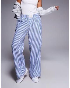 Nike Pantalon ample en popeline rayée - /blanc - Bleu