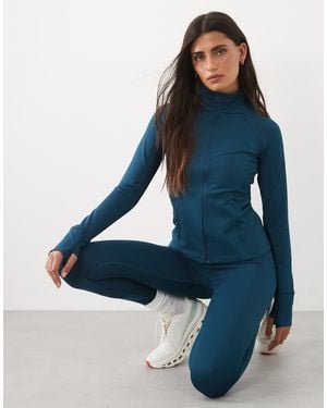 4505 Chaqueta De Manga Larga Moldeadora Con Cremallera Y Bolsillos Con Cremallera En Azul Verdoso