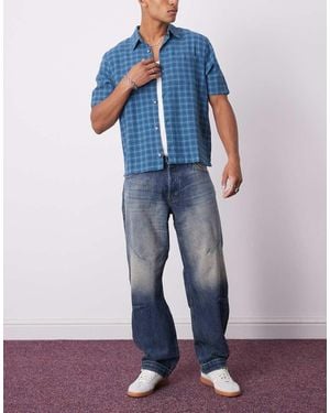 Weekday Low Waist Loose Fit Barrel Leg Jeans With Dart Shaping - Blue