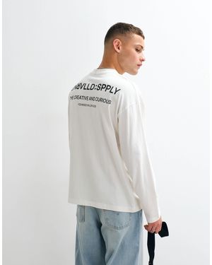 ASOS T-shirt oversize à manches longues et imprimé texte - crème - Blanc