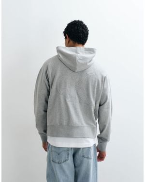 Calvin Klein Sweat à capuche terry monogramme - Gris