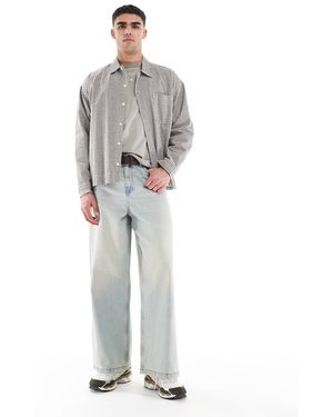 ASOS Jeans Super Ampi Lavaggio Azzurro Con Tinta Vintage - Grigio