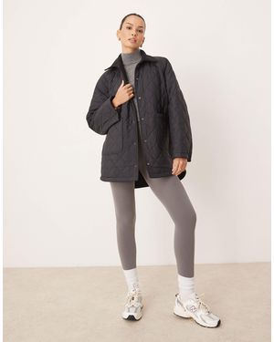 Tala – wendbare oversize-jacke aus gestepptem fleece - Schwarz