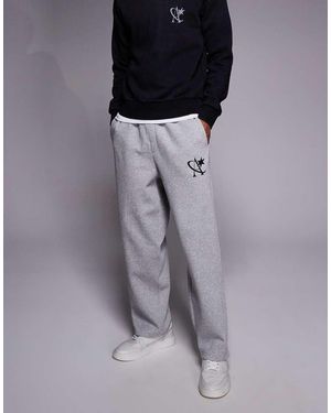 ADPT Joggers Gris Claro De Corte Suelto Con Logo De Estrella De