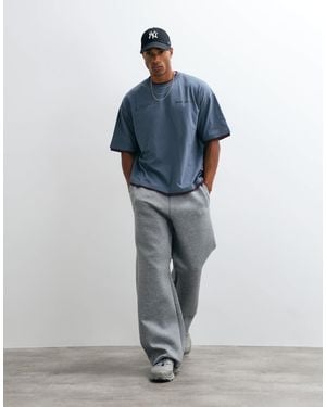 ASOS Oversize boxy t-shirt mit doppelter lage und grafik mit erhabenem druck - Blau
