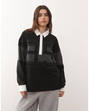 Nike Street - polo manches longues à motif - et noir