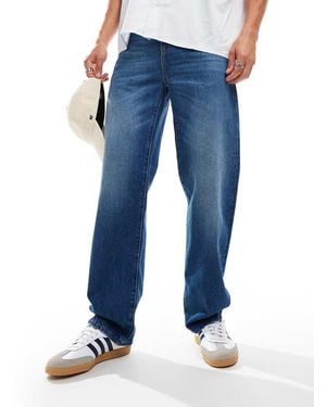 Lacoste Jeans Dritti Lavaggio Scuro - Blu