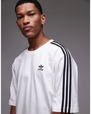 adidas Originals – adicolor – oversize-t-shirt - Grau
