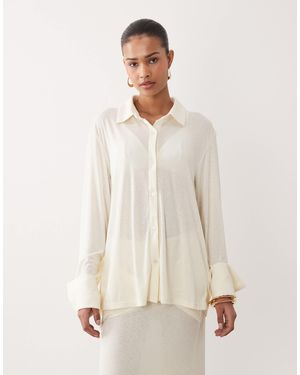 SNDY'S Chemise d'ensemble en maille douce et semi-transparente avec manchettes larges - cassé - Neutre