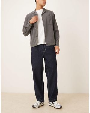 ASOS Relaxed Tapered Fit Jeans With Pleat Detail - Black