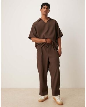 ASOS Relaxed Tapered Plisse jogger With Pleats - Natural