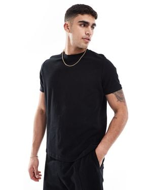 Bershka – strukturiertes t-shirt - Schwarz