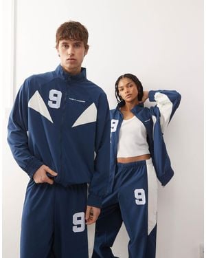 Collusion Unisex Graphic Nylon Track Top - Blue