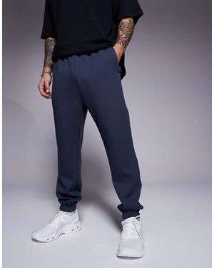 4505 Joggers Deportivos De Corte Tapered De Tejido De Secado Rápido Icon De - Azul