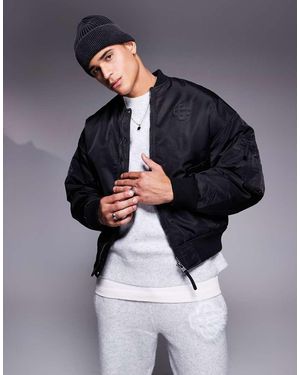 The Couture Club Oversized Emblem Bomber Jacket - Blue