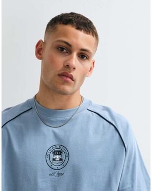 ASOS Boxy Oversized Cut And Sew T-shirt With Sports Graphic - Blue