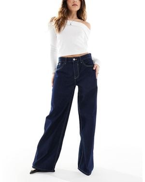 Bershka Jeans A Fondo Ampio Lavaggio Indaco - Blu