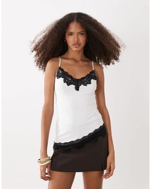 Fashionkilla Exclusive Slinky Contrast Lace Trim Asymmetric Hem Cami Top - White