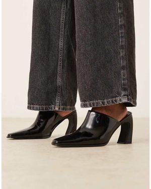 Raid Mules Negros Con Tacón Curvado Y Puntera Fina Hania De