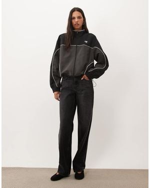 New Balance Chaqueta Negra De Tejido Liso Trackside De - Negro
