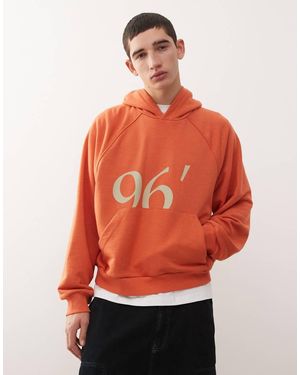 Reclaimed Vintage Raglan Sleeve Oversized Hoodie With Graphic - Orange