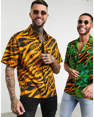 Versace Jeans Couture Chemise imprimé tigre avec col à revers et logo - et doré - Noir